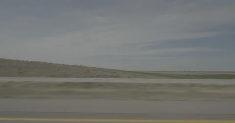 Side left driving plate - Highway 385 at Mile 100 Boxbutt County Stock Footage 290057016