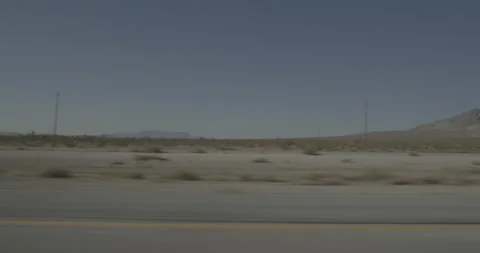 Side left driving plate - Highway 15 at Mile 164, Mountain Pass Stock Footage 293923312