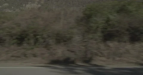 Side left driving plate - Highway 1 at Mile 72, Ragged Point Stock Footage 294932839