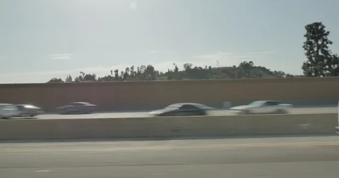 Side left driving plate - Hwy 405 at the Ventura Blvd sign, Los Angeles Stock Footage 101709372