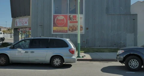 Side left driving plate - Western Ave at Elmwood Avenue, Downtown LA Stock Footage 114080771