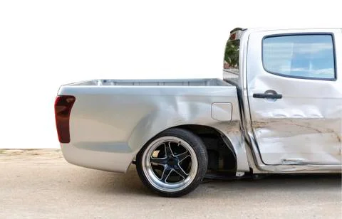 Side of light gray color car with pick up damaged and broken by accident on r Stock Photos