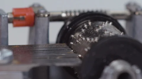 SIDE ON MACRO OF SMALL WIND UP MUSIC BOX PLAYING Stock Footage 126420385