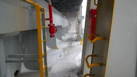 Side main deck pass way of large container vessel with full of snow Stock Footage 244385049