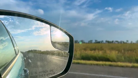 Side mirror of a car close-up. Car mirror with reflection of the road close-up Stock Footage 307314366