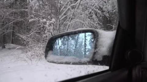 Side mirror of the car close-up of the interior snow winter forest. Stock Footage 146651495