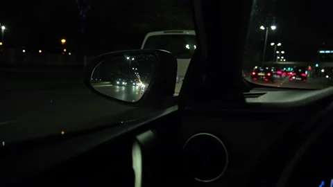 Side Mirror Reflection of Car Traffic in Night City Street Stock Footage 220609509