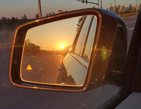 Side mirror reflection of sunset Foto stock