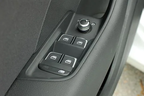 Side mirror switch control and window button Stock Photos