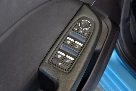 Side mirror switch control and window button Stock Photos