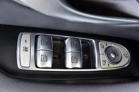 Side mirror switch control and window button Stock Photos