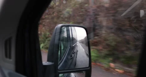 Side mirror view car drive in dark van through germany under bridge Stock Footage 230491930