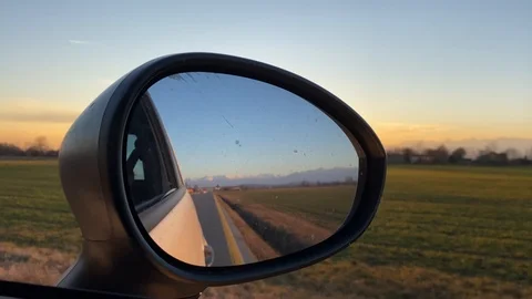 Side Mirror View In Car Driving at Sunset Stock Footage 124371595