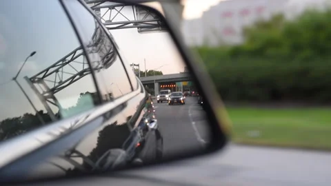 Side mirror view driving on the highway Stock Footage 197104333