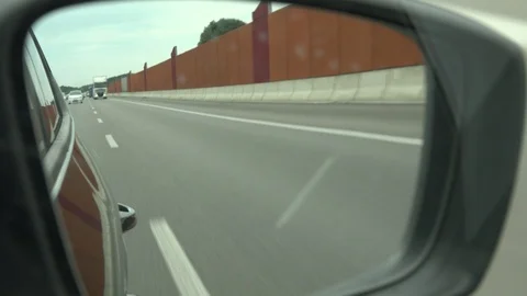 Side mirror view of motorway Vídeo Stock 100341458