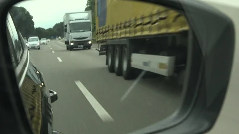 Side mirror view of motorway Vídeo Stock 100341550