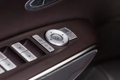 Side mirrors control panel on side door. Stock Photos