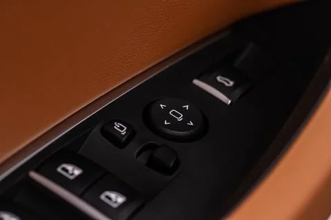 Side mirrors control panel on side door. Stock Photos