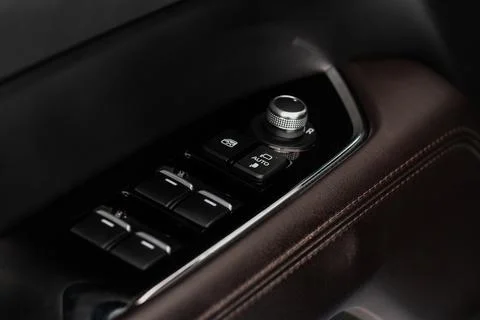 Side mirrors control panel on side door. Stock Photos