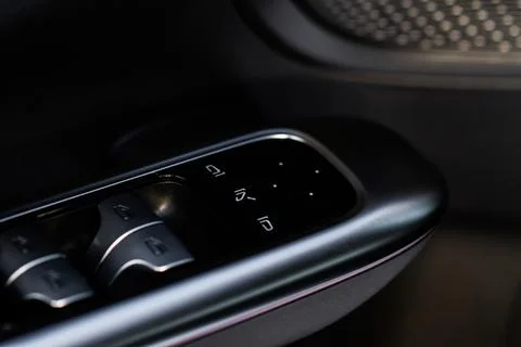 Side mirrors control panel on side door. Stock Photos