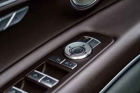 Side mirrors control panel on side door. 스톡 사진