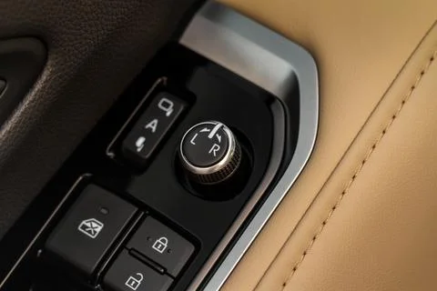 Side mirrors control panel on side door. Stock Photos