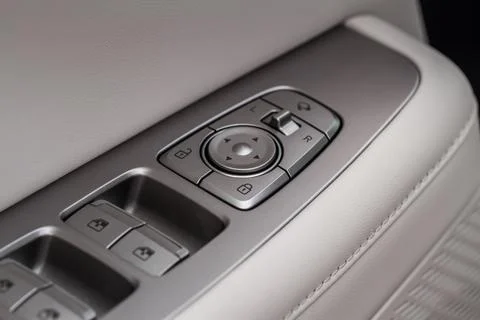 Side mirrors control panel on side door. Stock Photos