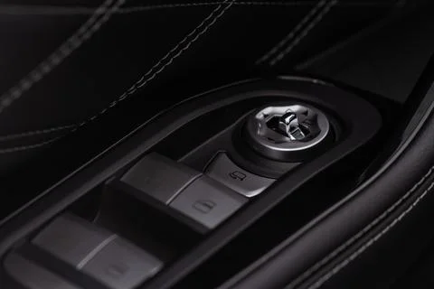 Side mirrors control panel on side door. Car driver adjust side mirror contro Stock Photos