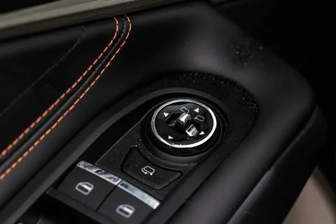 Side mirrors control panel on side door. Stock Photos