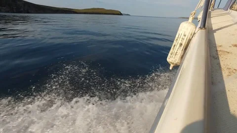 Side of the motor boat sailing. Smooth surface of lake Baikal. Water splashes Stock Footage 128926628