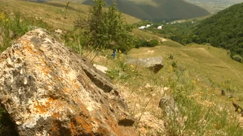 Side of a Mountain Overlooking a Small Village Stock Footage 53232745