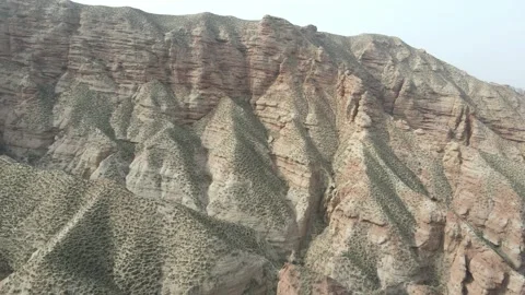 Side Moving Drone Along Red Danxia Canyon Cliffs Zhangye Gansu China Video stock 330458985