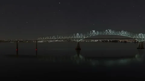 Side night aerial drone view of the Francis Scott Key Bridge in Maryland Stock Footage 270151778