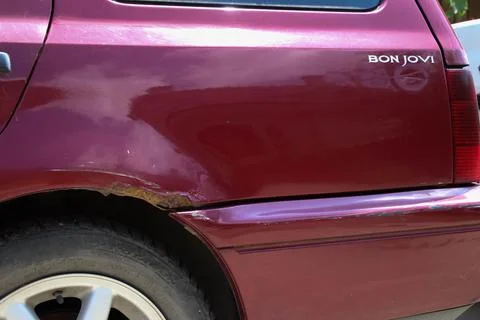 Side of an old rusted car. Stock Photos
