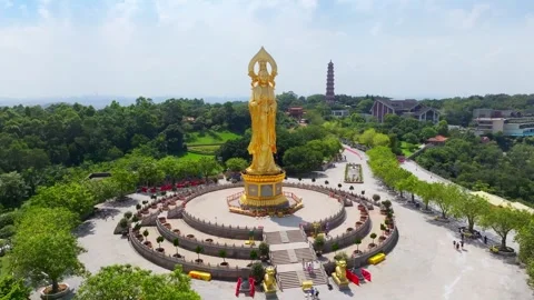 Side orbit around Guanyin and temple terraces in Guangzhou China Stock Footage 345959096