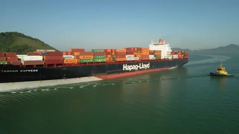 Side orbit of a big vessel/cargo chip full of containers in the open ocean Stock Footage 225434782