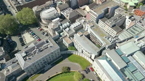 Side-on, overhead aerial video of the grounds at Seanad Éireann in Dublin City Stock Footage 309843114