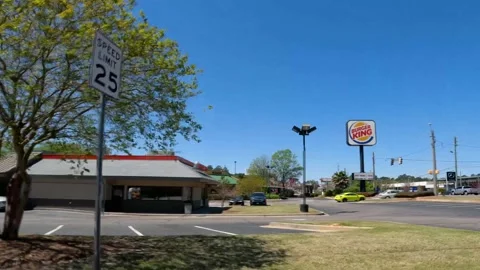 Side pan Burger King restaurant clear blue sky Washington Road Stock Footage 174385172