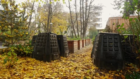 Side pan of composting bins in a ecological community Stock Footage 143860248