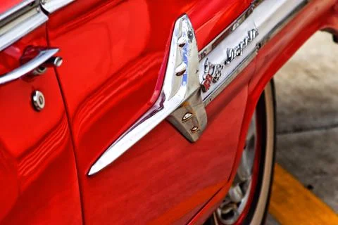 Side panel detail of chrome Impala car badge.  Stock Photos