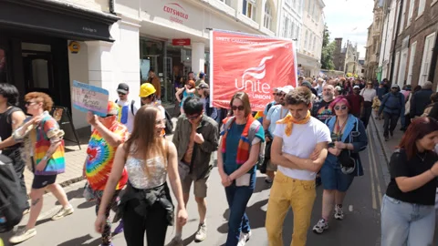 From the side of the parade - watching people march past a church Stock Footage 338017800