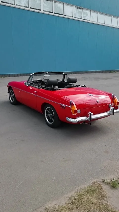 Side part of red MGB classic roadster. Stock Footage 329228159