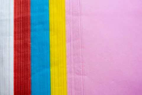 Side pattern image of a pile of colorful paper That has pink, yellow, blue, r Stock Photos