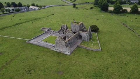 Side perspective of ancient monastery ruins in an open field. Stock Footage 327624128