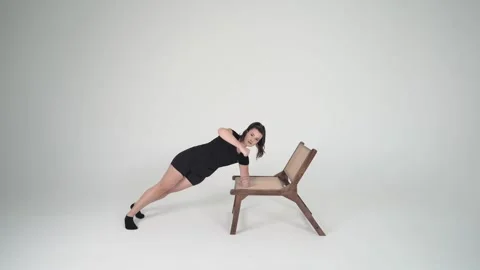 Side plank arm on chair Stock Footage 314195912