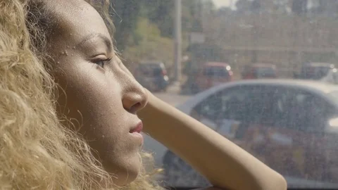 Side portrait of a depressed woman on the bus in the town Stock Footage
