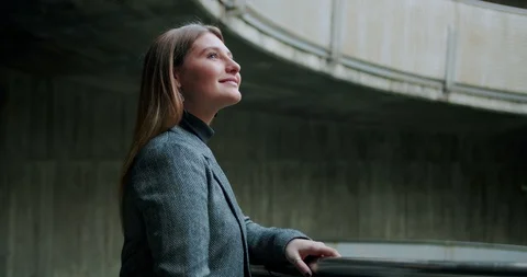Side portrait of successful young student female looking up to day light urban Stock Footage 120745269