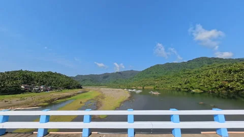 Side POV driving on bridge past blue and yellow barriers. Stock Footage 337518200