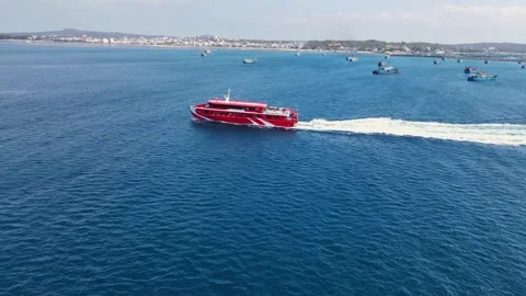 Side profile aerial tracking shot of a luxury yacht cruising ocean 4K Stock Footage 336040083