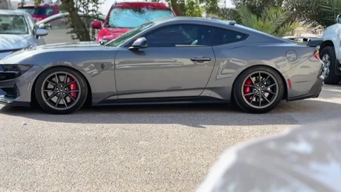 Side profile of gray performance sports coupe parked in urban parking lot Stock-Footage 331965468